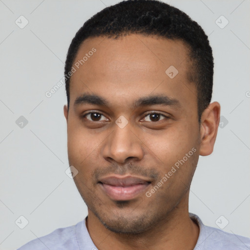 Joyful black young-adult male with short  black hair and brown eyes