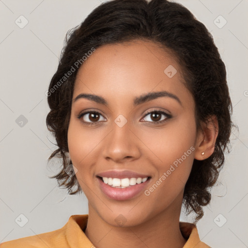 Joyful latino young-adult female with long  brown hair and brown eyes