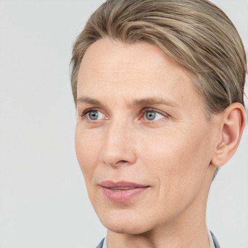 Joyful white adult female with short  brown hair and grey eyes