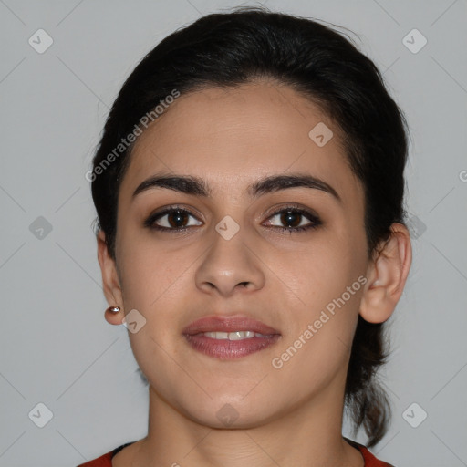 Joyful latino young-adult female with medium  brown hair and brown eyes