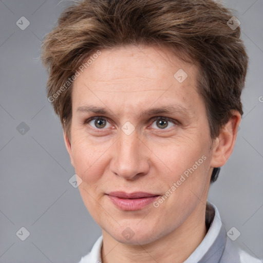 Joyful white adult female with short  brown hair and brown eyes