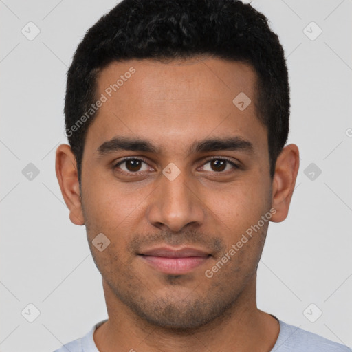 Joyful latino young-adult male with short  brown hair and brown eyes