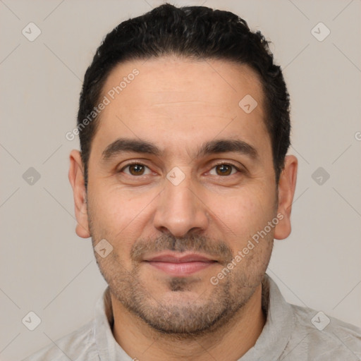 Joyful white young-adult male with short  black hair and brown eyes