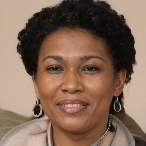 Joyful latino adult female with short  brown hair and brown eyes