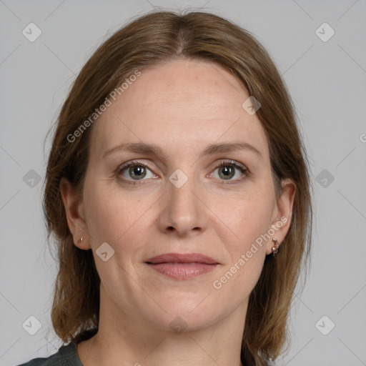 Joyful white adult female with medium  brown hair and grey eyes