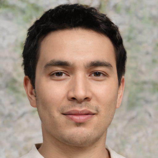 Joyful asian young-adult male with short  brown hair and brown eyes