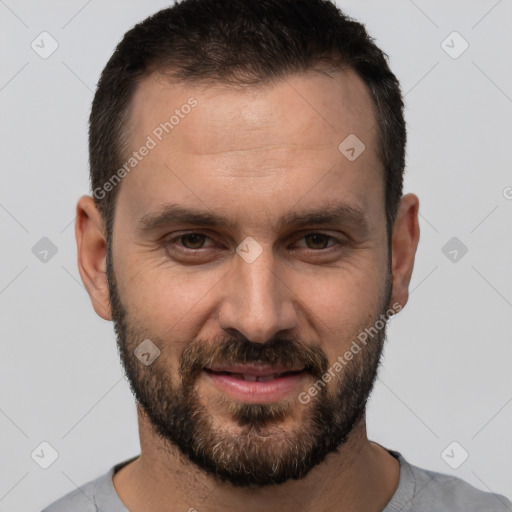 Joyful white adult male with short  brown hair and brown eyes