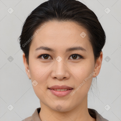 Joyful asian young-adult female with medium  brown hair and brown eyes