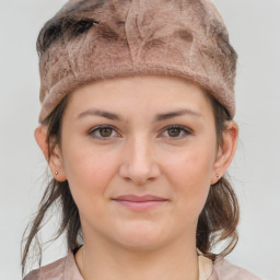 Joyful white young-adult female with medium  brown hair and grey eyes