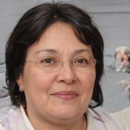 Joyful white middle-aged female with medium  brown hair and brown eyes