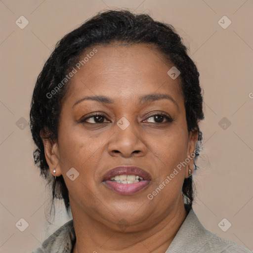 Joyful black adult female with medium  brown hair and brown eyes