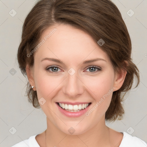 Joyful white young-adult female with medium  brown hair and green eyes