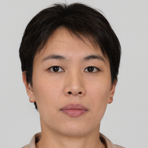 Neutral asian young-adult female with short  brown hair and brown eyes