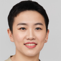 Joyful asian young-adult female with short  black hair and brown eyes