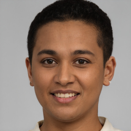 Joyful latino young-adult female with short  brown hair and brown eyes