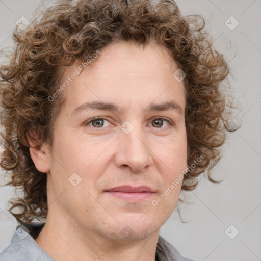 Joyful white adult male with medium  brown hair and brown eyes