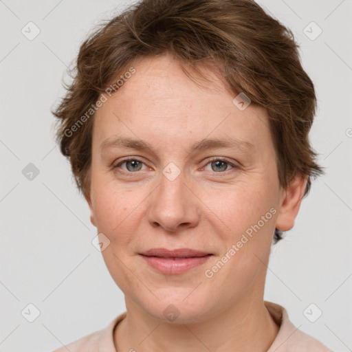 Joyful white adult female with short  brown hair and grey eyes