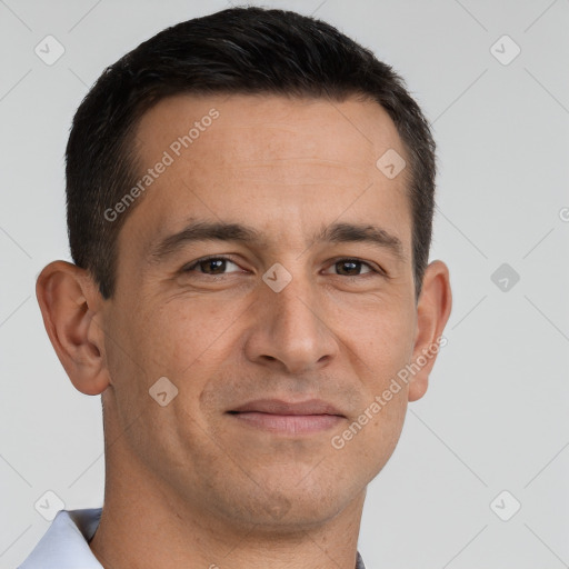 Joyful white adult male with short  brown hair and brown eyes