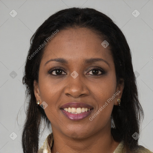 Joyful black young-adult female with long  brown hair and brown eyes