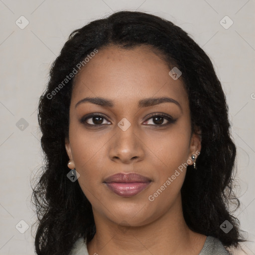 Joyful black young-adult female with long  black hair and brown eyes