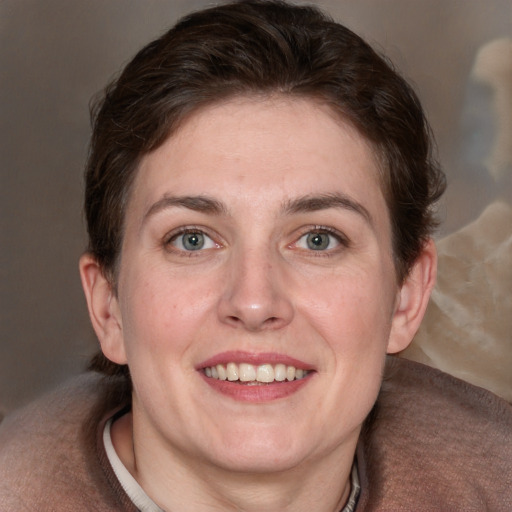 Joyful white adult female with medium  brown hair and blue eyes