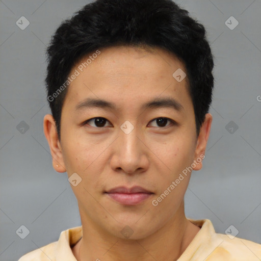 Joyful asian young-adult male with short  brown hair and brown eyes