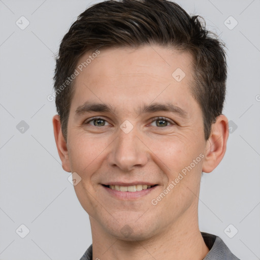 Joyful white young-adult male with short  brown hair and brown eyes