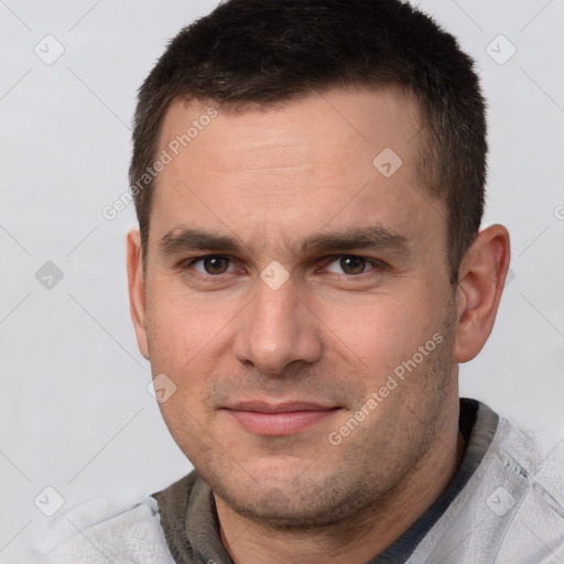 Joyful white young-adult male with short  brown hair and brown eyes