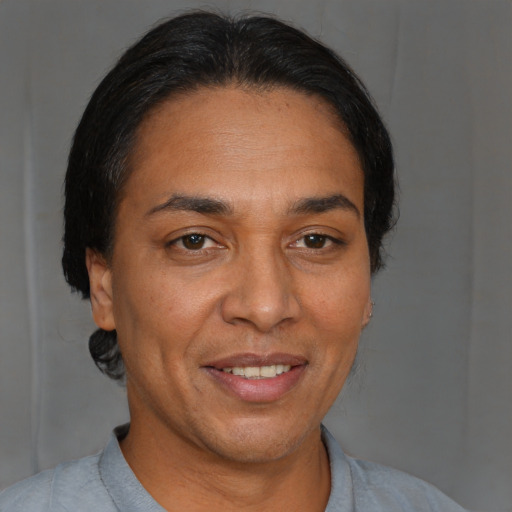 Joyful white adult female with short  brown hair and brown eyes