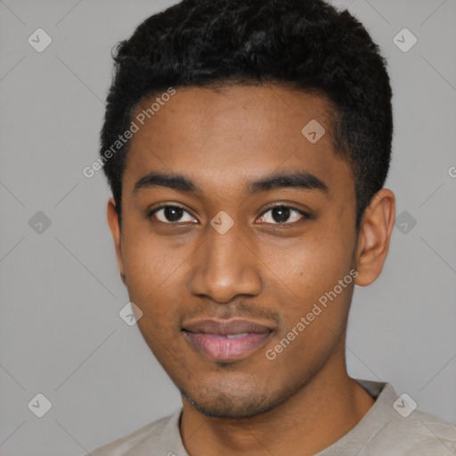 Joyful black young-adult male with short  black hair and brown eyes