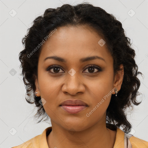 Joyful black young-adult female with long  brown hair and brown eyes