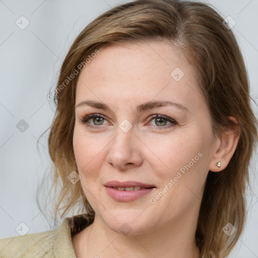 Joyful white young-adult female with medium  brown hair and blue eyes