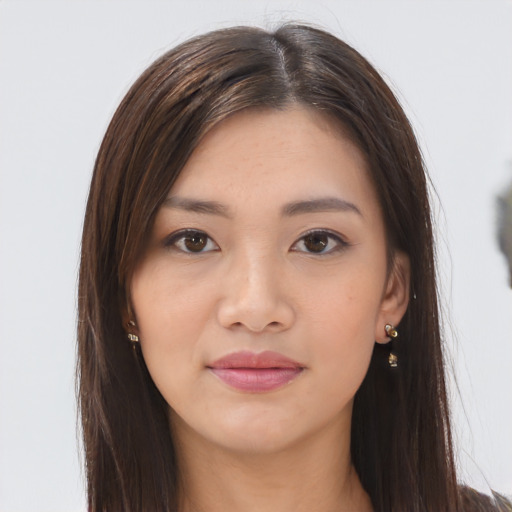 Joyful asian young-adult female with long  brown hair and brown eyes