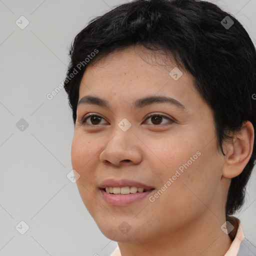 Joyful asian young-adult female with short  black hair and brown eyes