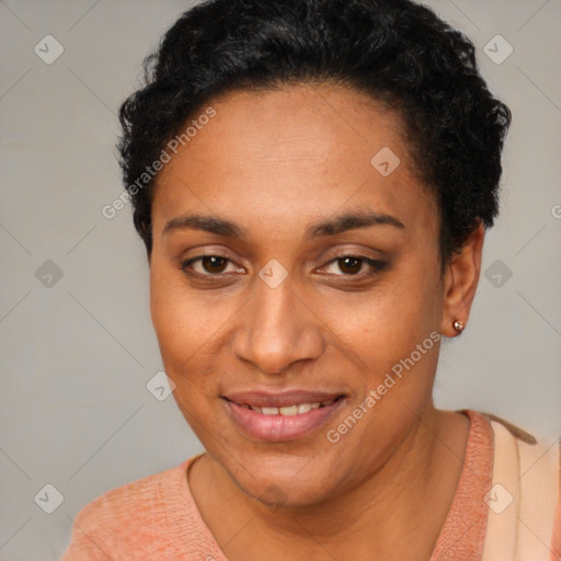 Joyful latino young-adult female with short  black hair and brown eyes