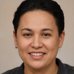 Joyful white adult female with short  brown hair and brown eyes