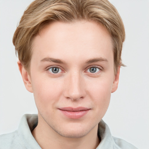 Joyful white young-adult female with short  brown hair and blue eyes