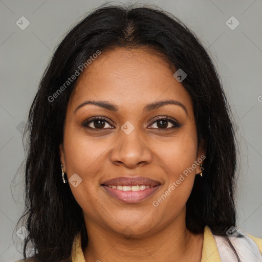 Joyful black adult female with medium  brown hair and brown eyes