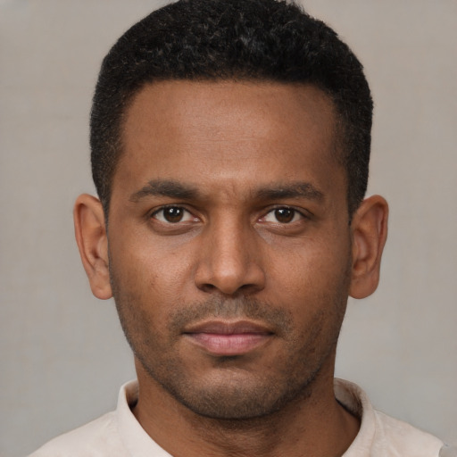 Neutral latino young-adult male with short  brown hair and brown eyes