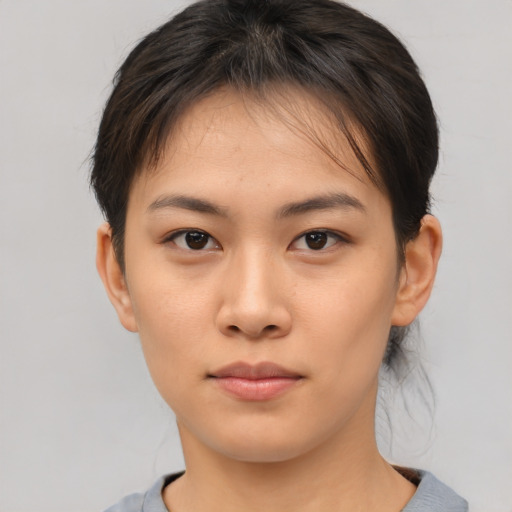 Neutral asian young-adult female with short  brown hair and brown eyes