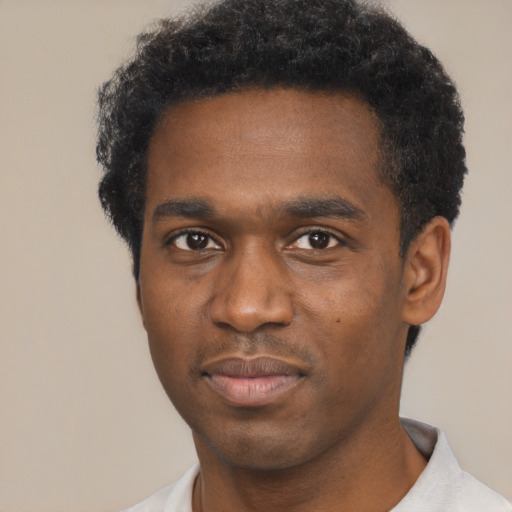 Neutral black young-adult male with short  black hair and brown eyes