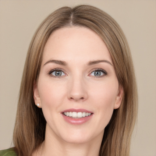 Joyful white young-adult female with long  brown hair and green eyes