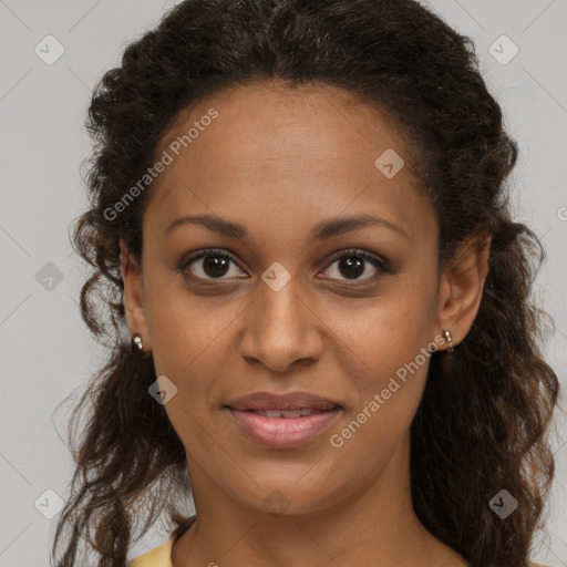 Joyful black young-adult female with long  brown hair and brown eyes