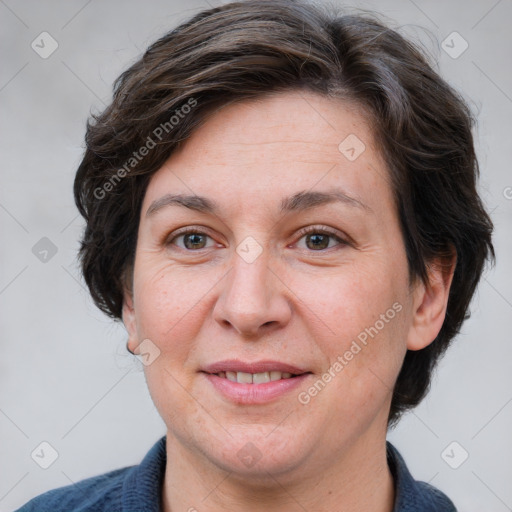 Joyful white adult female with medium  brown hair and grey eyes