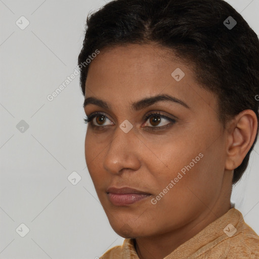 Neutral black young-adult female with short  brown hair and brown eyes