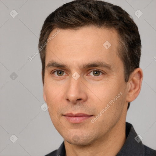 Joyful white adult male with short  brown hair and brown eyes