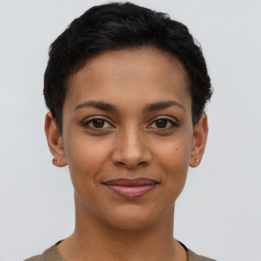 Joyful latino young-adult female with short  brown hair and brown eyes