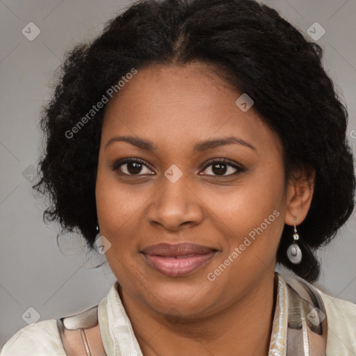 Joyful black adult female with medium  brown hair and brown eyes