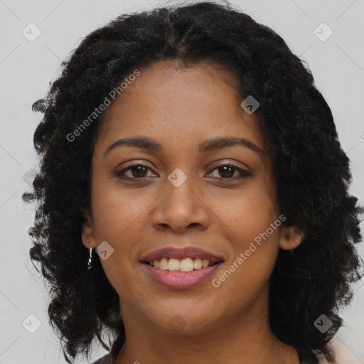 Joyful black young-adult female with long  brown hair and brown eyes