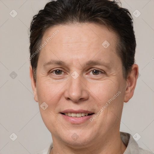 Joyful white adult female with short  brown hair and brown eyes